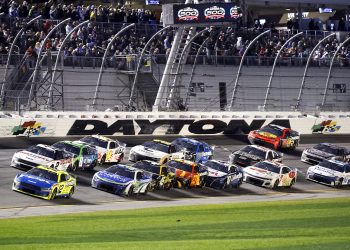 Ryan Blaney leads the field during the NASCAR Cup Series 2024 Daytona 500 at Daytona International Speedway.