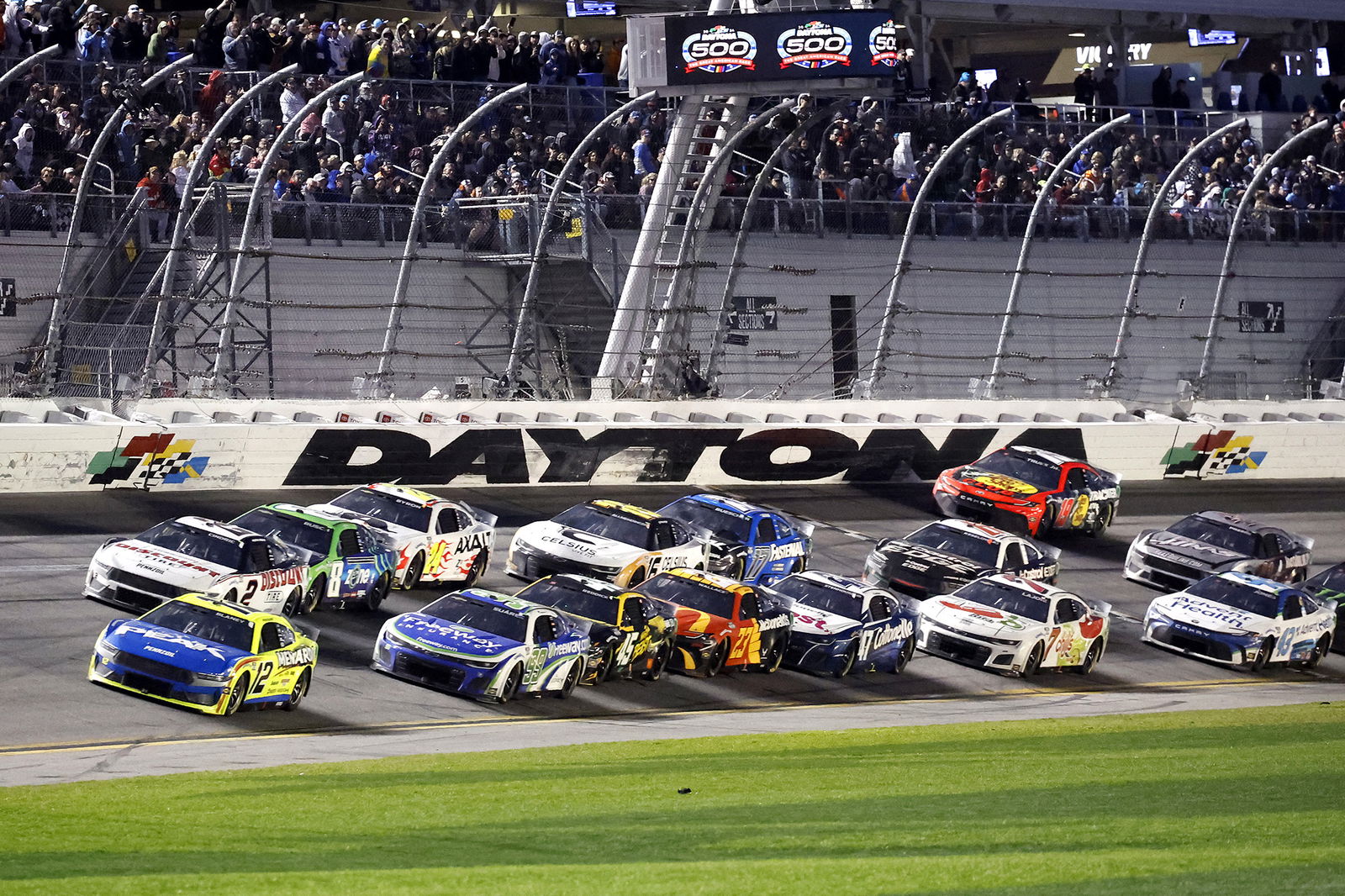 Ryan Blaney leads the field during the NASCAR Cup Series 2024 Daytona 500 at Daytona International Speedway. 