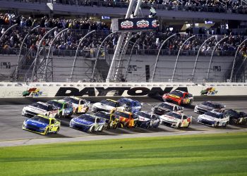 DAYTONA BEACH, FLORIDA - FEBRUARY 19: Ryan Blaney, driver of the #12 Menards/PEAK Ford, leads the field during the NASCAR Cup Series Daytona 500 at Daytona International Speedway on February 19, 2024 in Daytona Beach, Florida. (Photo by Chris Graythen/Getty Images)