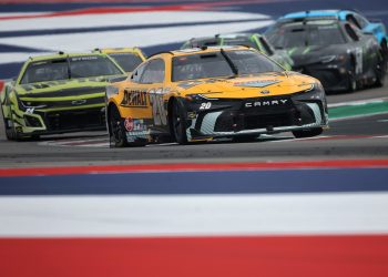 AUSTIN, TEXAS - MARCH 24: Christopher Bell, driver of the #20 DEWALT Toyota, and William Byron, driver of the #24 RaptorTough.com Chevrolet, race during the NASCAR Cup Series EchoPark Automotive Grand Prix at Circuit of The Americas on March 24, 2024 in Austin, Texas. (Photo by Jonathan Bachman/Getty Images)