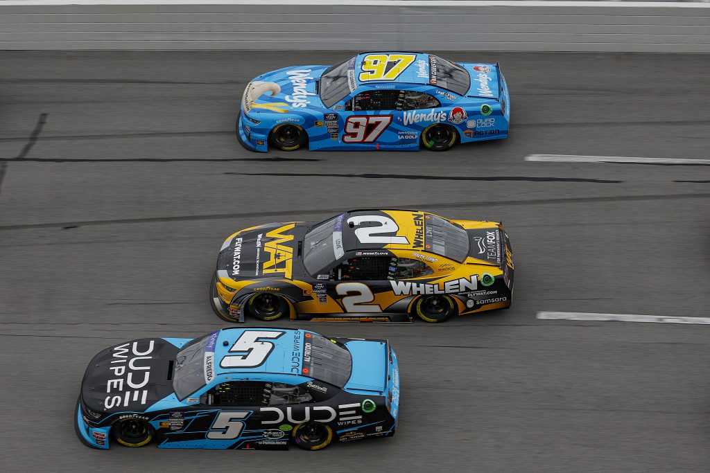 TALLADEGA, ALABAMA - APRIL 20: Anthony Alfredo, driver of the #5 Dude Wipes Chevrolet, Jesse Love, driver of the #2 WAT Chevrolet, and Shane Van Gisbergen, driver of the #97 Wendy's Chevrolet, race during the NASCAR Xfinity Series Ag-Pro 300 at Talladega Superspeedway on April 20, 2024 in Talladega, Alabama. (Photo by Sean Gardner/Getty Images)