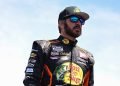 SONOMA, CALIFORNIA - JUNE 08: Martin Truex Jr., driver of the #19 Bass Pro Shops Toyota, walks the grid during qualifying for the NASCAR Cup Series Toyota/Save Mart 350 at Sonoma Raceway on June 08, 2024 in Sonoma, California. (Photo by Logan Riely/Getty Images)
