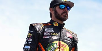 SONOMA, CALIFORNIA - JUNE 08: Martin Truex Jr., driver of the #19 Bass Pro Shops Toyota, walks the grid during qualifying for the NASCAR Cup Series Toyota/Save Mart 350 at Sonoma Raceway on June 08, 2024 in Sonoma, California. (Photo by Logan Riely/Getty Images)