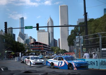 CHICAGO, ILLINOIS - JULY 06: Kyle Larson, driver of the #17 HendrickCars.com Chevrolet, and Shane Van Gisbergen, driver of the #97 WeatherTech Chevrolet, race during the NASCAR Xfinity Series The Loop 110 at Chicago Street Course on July 06, 2024 in Chicago, Illinois. (Photo by James Gilbert/Getty Images)