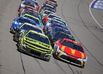 Tyler Reddick leads William Byron on the final restart of the FireKeepers 400 at Michigan International Speedway.