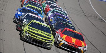 Tyler Reddick leads William Byron on the final restart of the FireKeepers 400 at Michigan International Speedway.