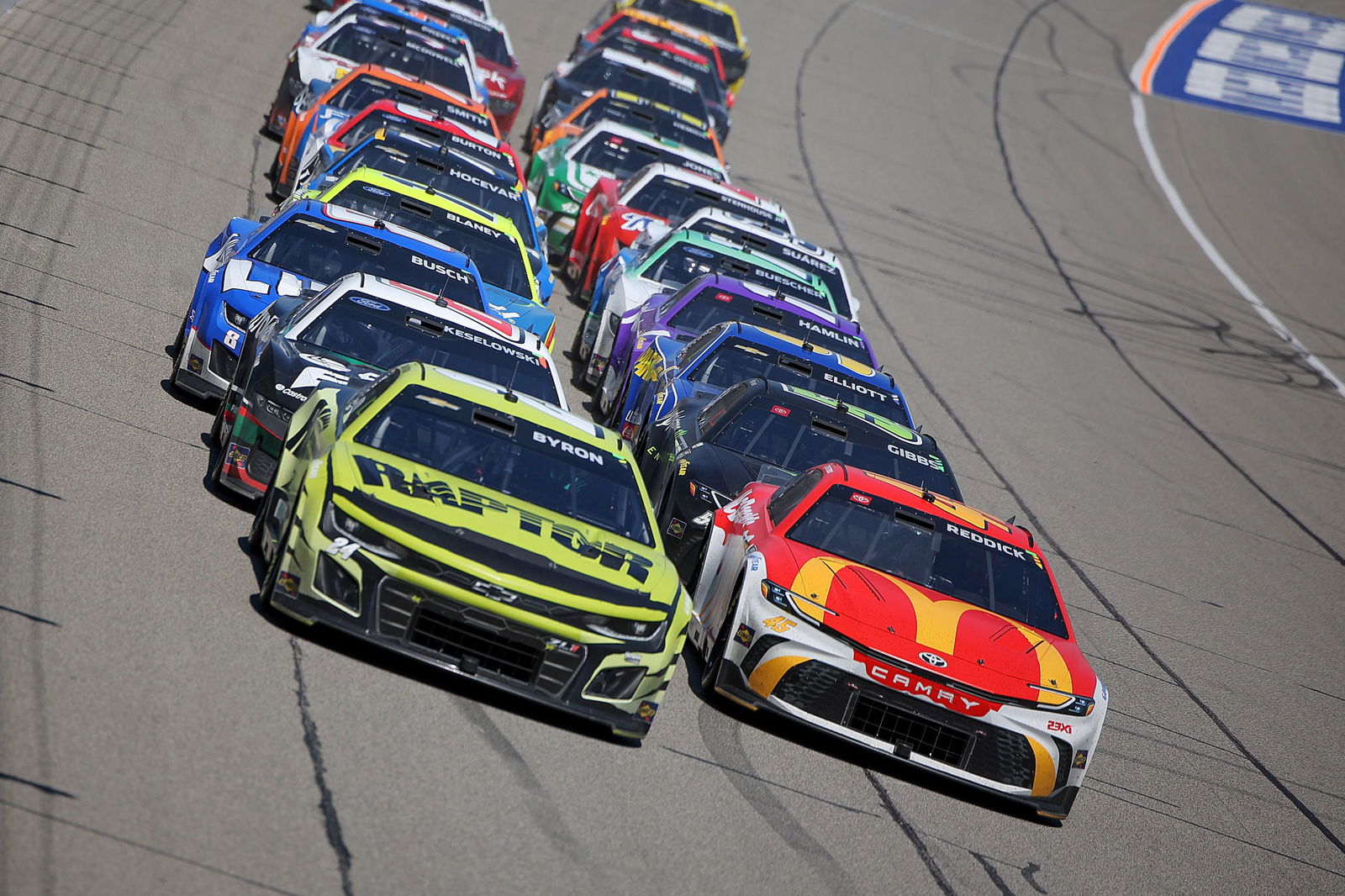 Tyler Reddick leads William Byron on the final restart of the FireKeepers 400 at Michigan International Speedway.