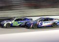 Kyle Larson, driver of the #5 HendrickCars.com Chevrolet, and Daniel Suarez, driver of the #99 Freeway Insurance Chevrolet, race during the NASCAR Cup Series Bass Pro Shops Night Race at Bristol Motor Speedway. Image: James Gilbert/Getty Images