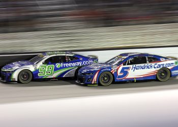 Kyle Larson, driver of the #5 HendrickCars.com Chevrolet, and Daniel Suarez, driver of the #99 Freeway Insurance Chevrolet, race during the NASCAR Cup Series Bass Pro Shops Night Race at Bristol Motor Speedway. Image: James Gilbert/Getty Images