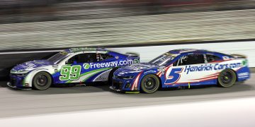 Kyle Larson, driver of the #5 HendrickCars.com Chevrolet, and Daniel Suarez, driver of the #99 Freeway Insurance Chevrolet, race during the NASCAR Cup Series Bass Pro Shops Night Race at Bristol Motor Speedway. Image: James Gilbert/Getty Images