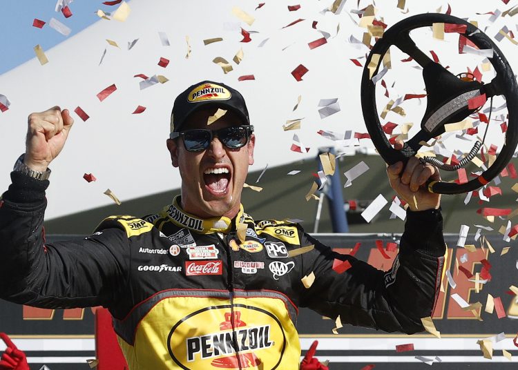 Joey Logano celebrates in victory lane after winning the NASCAR Cup Series South Point 400 at Las Vegas Motor Speedway.