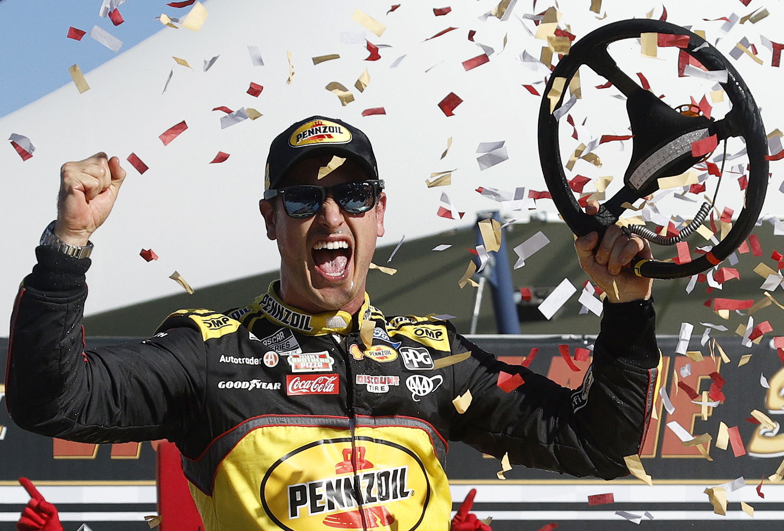 Joey Logano celebrates in victory lane after winning the NASCAR Cup Series South Point 400 at Las Vegas Motor Speedway. 