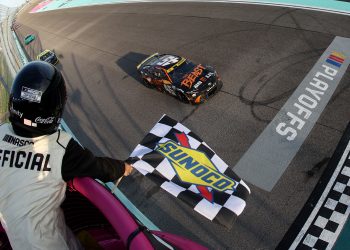 Tyler Reddick, driver of the #45 Toyota, takes the chequered flag to win the NASCAR Cup Series Straight Talk Wireless 400 at Homestead-Miami Speedway.