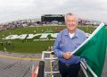 NASCAR legend Bobby Allison poses with the green flag prior to starting the NASCAR Cup Series Daytona 500 at Daytona International Speedway in 2009. Image: