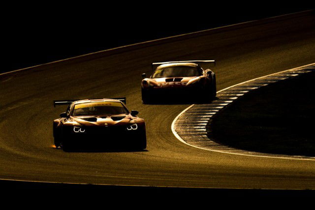 BMW and Ferrari go head-to-head in the golden light at Phillip Island 