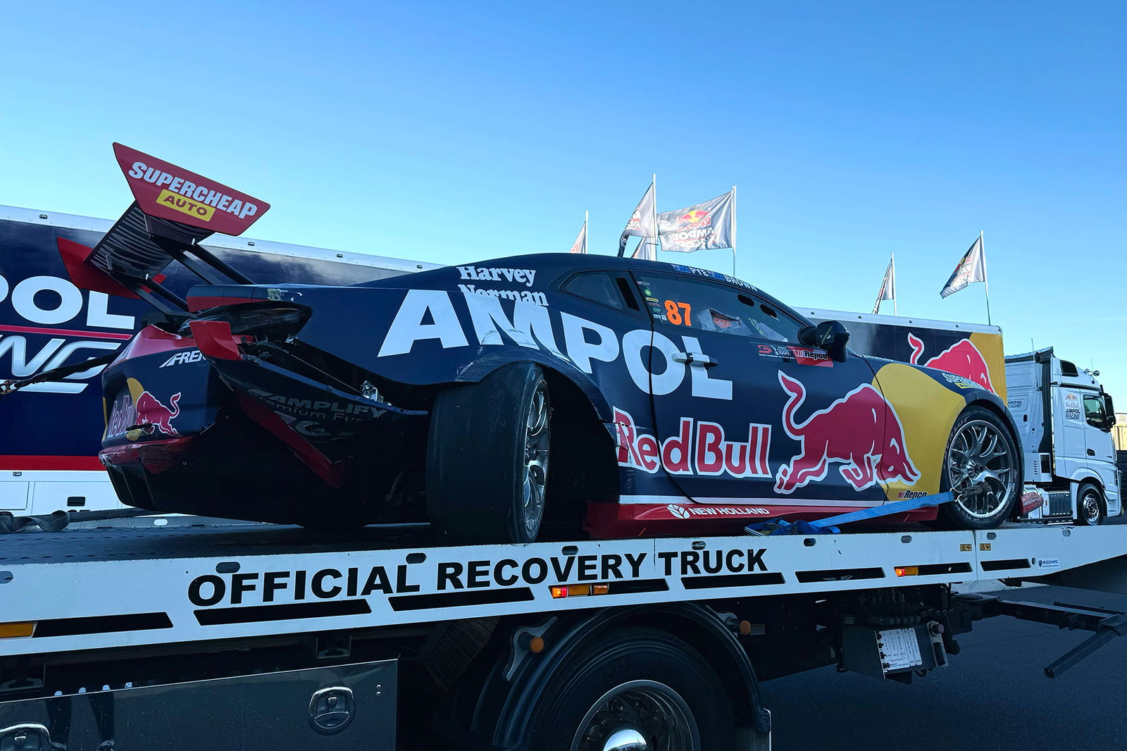 The wounded #87 Red Bull Ampol Racing Chevrolet Camaro.