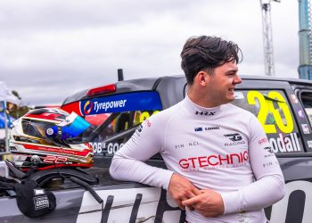 Rueben Goodall stands next to a V8 SuperUte at Adelaide in November 2023