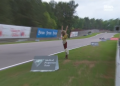 Georgina the mannequin falls onto the track during the IndyCar race at Barber Motorsports Park. Image: Stan Sport