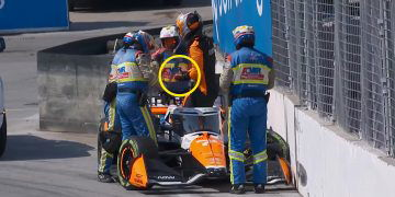 Alexander Rossi grasps his thumb after crashing at turn eight in Toronto.