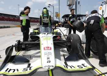 Jack Harvey climbs from his #18 Dale Coyne Racing car.