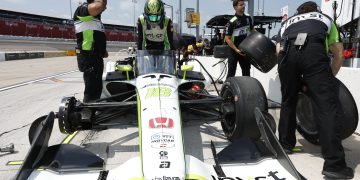 Jack Harvey climbs from his #18 Dale Coyne Racing car.