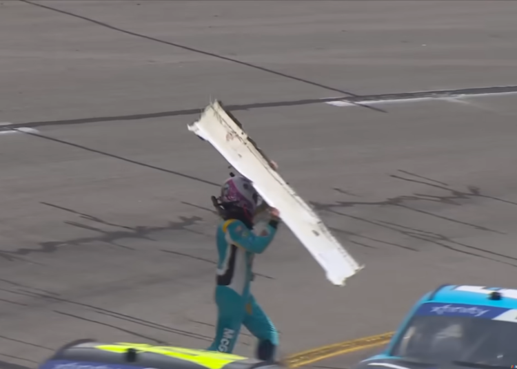 Joey Gase throws a bumper at Dawson Cram's car after a crash in the NASCAR Xfinity Series race at Richmond. Image: NASCAR broadcast