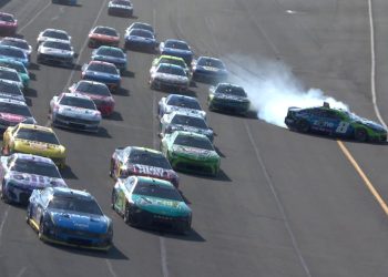 Kyle Busch mid-spin after contact from Corey LaJoie.