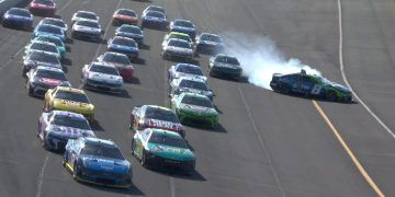 Kyle Busch mid-spin after contact from Corey LaJoie.