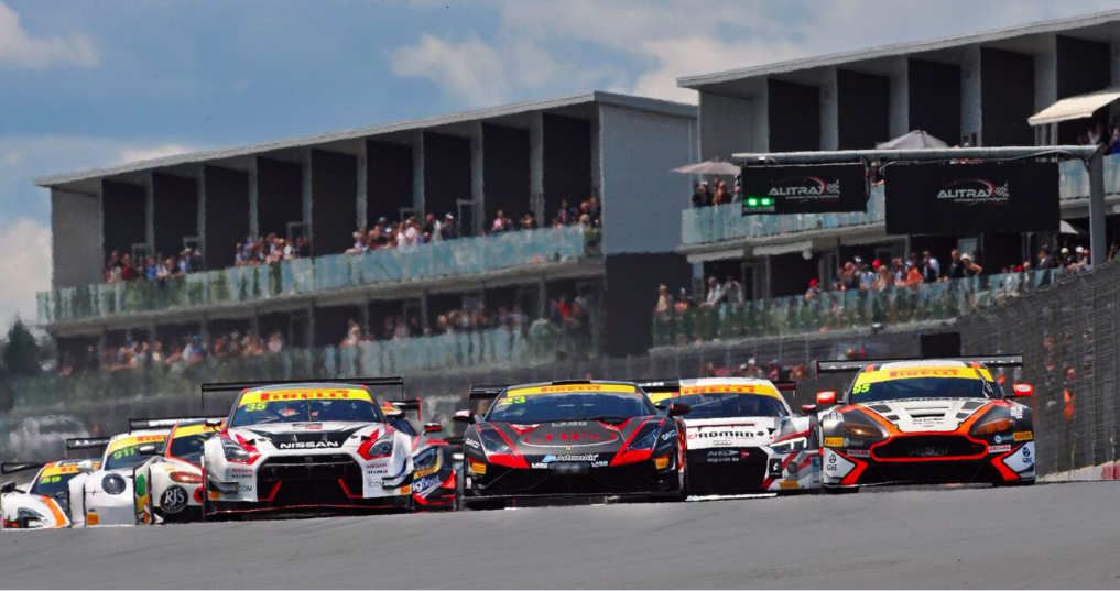 David Russell (centre) blasts away at the start of the Hampton Downs 101. Despite a drive-through penalty Russell and Roger Lago prevailed