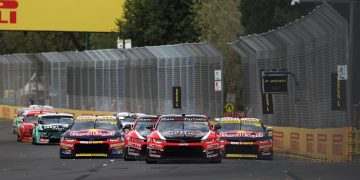 Supercars converge of Turn 3 of the Albert Park Grand Prix Circuit in Race 4 of the 2023 championship as part of the Melbourne SuperSprint at the F1 AGP