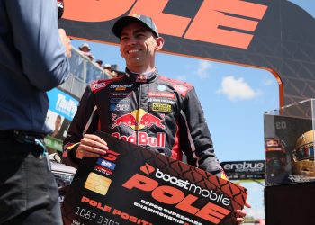 Broc Feeney wearing a Red Bull Ampol Racing hat while accepting the pole award in Bathurst. Image: Supercars