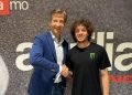 Aprilia Racing CEO Massimo Rivola (left) welcomes Marco Bezzecchi (right) to its MotoGP team. Image: Aprilia Racing