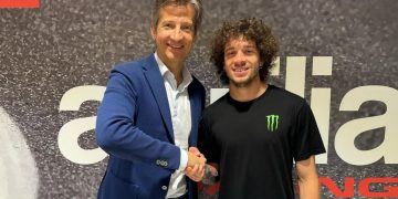 Aprilia Racing CEO Massimo Rivola (left) welcomes Marco Bezzecchi (right) to its MotoGP team. Image: Aprilia Racing