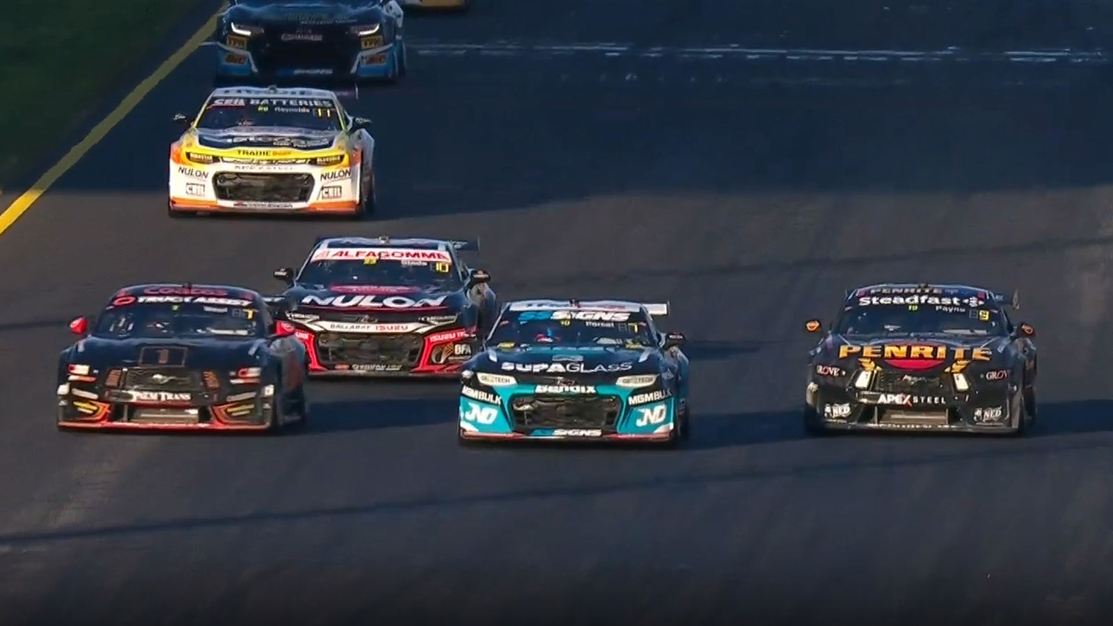 Ryan Wood (from left), Nick Percat, and Matt Payne go three-wide into turn one at Sydney Motorsport Park.