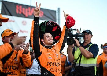 Pato O'Ward celebrates victory at the Milwaukee Mile.