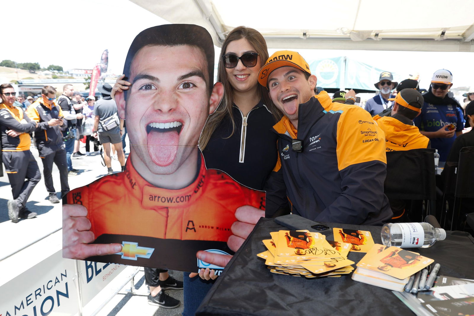 Pato O'Ward with a fan during a signing session at Laguna Seca. 