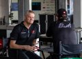 Campbell Little talks to Brad Jones at the back of a BJR garage at the Supercars Adelaide 500 in November 2023
