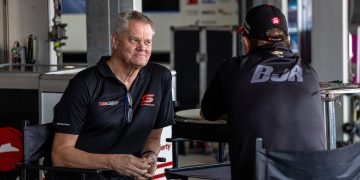Campbell Little talks to Brad Jones at the back of a BJR garage at the Supercars Adelaide 500 in November 2023