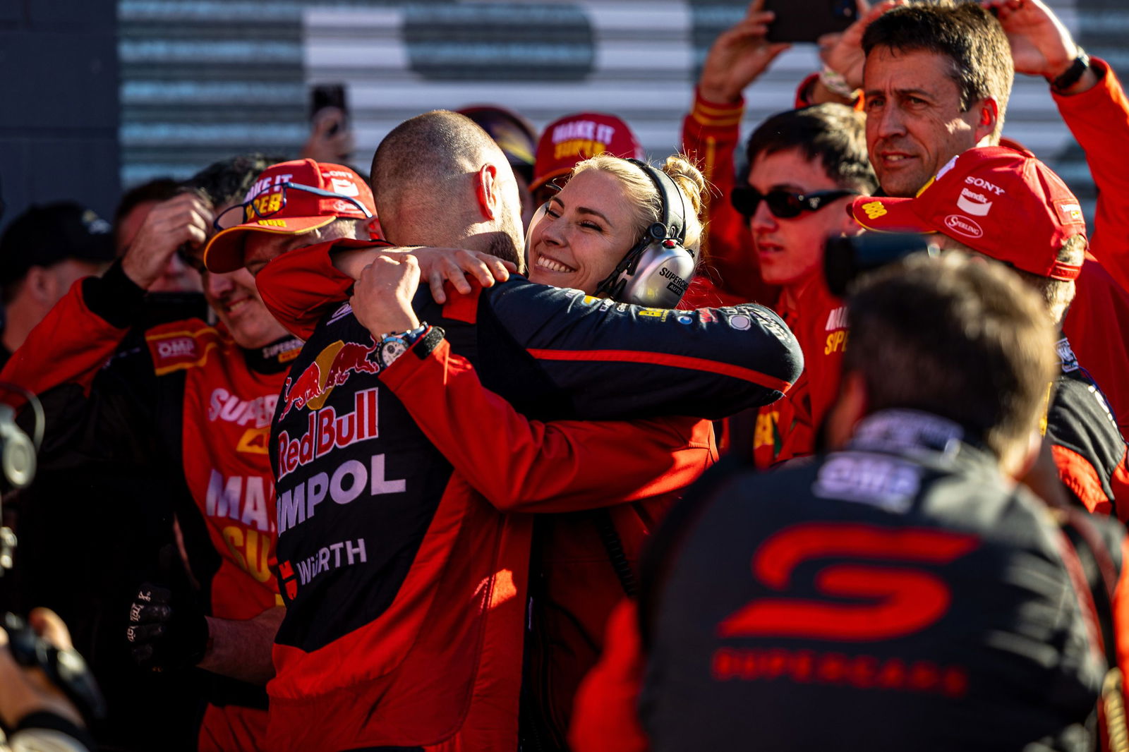 Jess Dane embraces Shane van Gisbergen after he won the 2022 Bathurst 1000. 