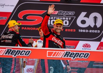 Brodie Kostecki waves from Bathurst 1000 podium in October 2023