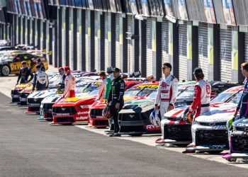 2024 Supercars Championship drivers pose with their cars in pit lane at Mount Panorama at the Bathurst 500 in February 2024