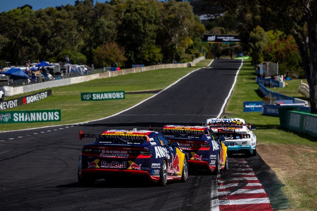 Chaz Mostert leads Will Brown and Broc Feeney off Hell Corner and up Mountain Straight at Mount Panorama at the Bathurst 500 in February 2024