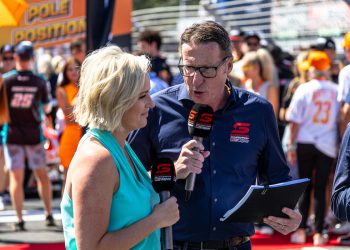 Fox Sports host Jessica Yates and commentator Mark Skaife stand on the grid at the 2023 Gold Coast 500