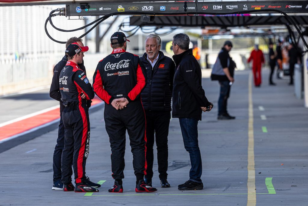 Supercars CEO Shane Howard converses with Brodie Kostecki and then-Erebus team-mate Will Brown at The Bend in August 2023. Image: InSyde Media