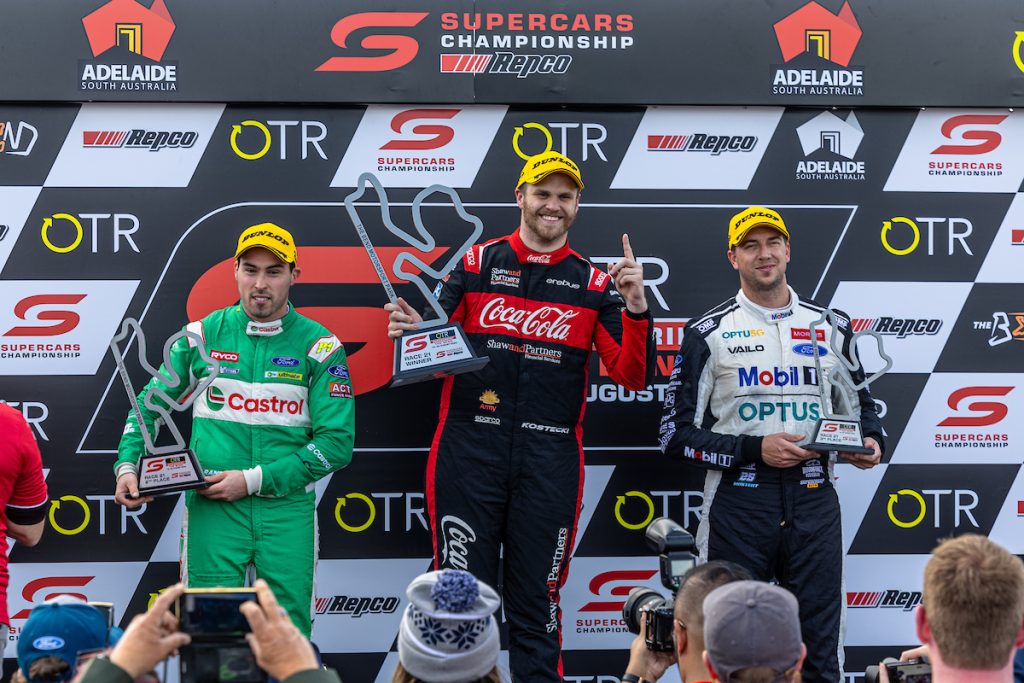 Brodie Kostecki, Thomas Randle, Chaz Mostert stand on the podium at The Bend in August 2023