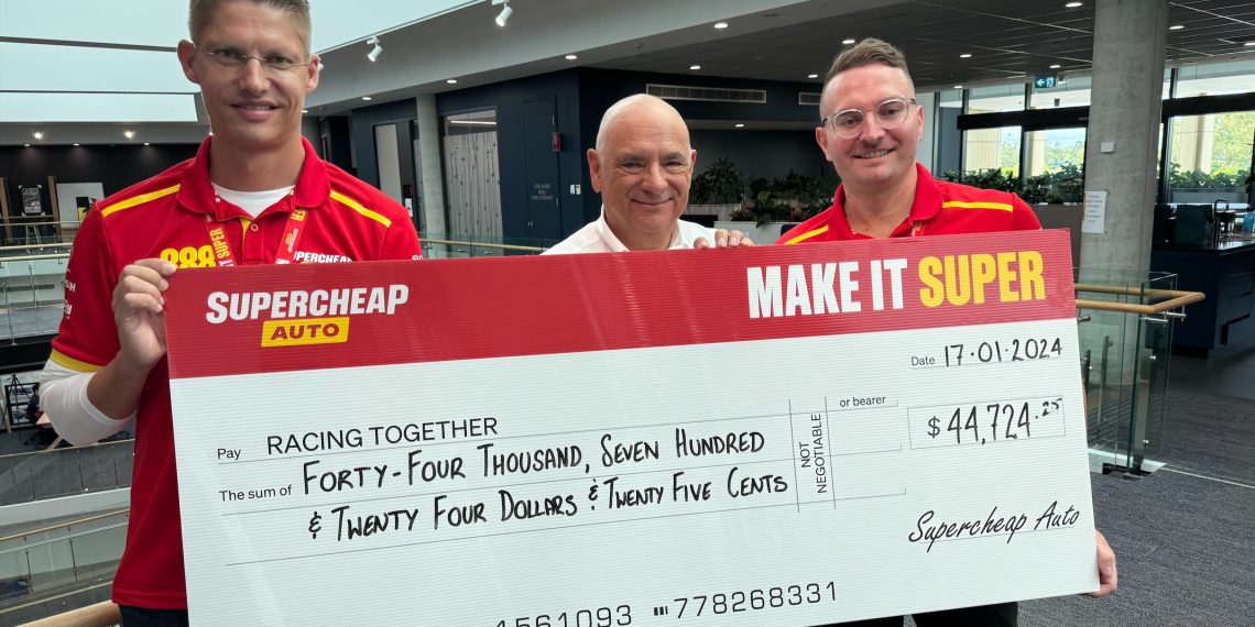 Roland Dane, flanked by Supercheap Auto's Andre Korte (left of shot), and Justin Murray (right) accepts the donation to Racing Together. Image: Supplied