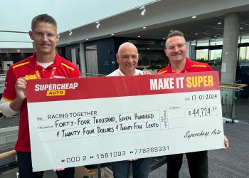 Roland Dane, flanked by Supercheap Auto's Andre Korte (left of shot), and Justin Murray (right) accepts the donation to Racing Together. Image: Supplied