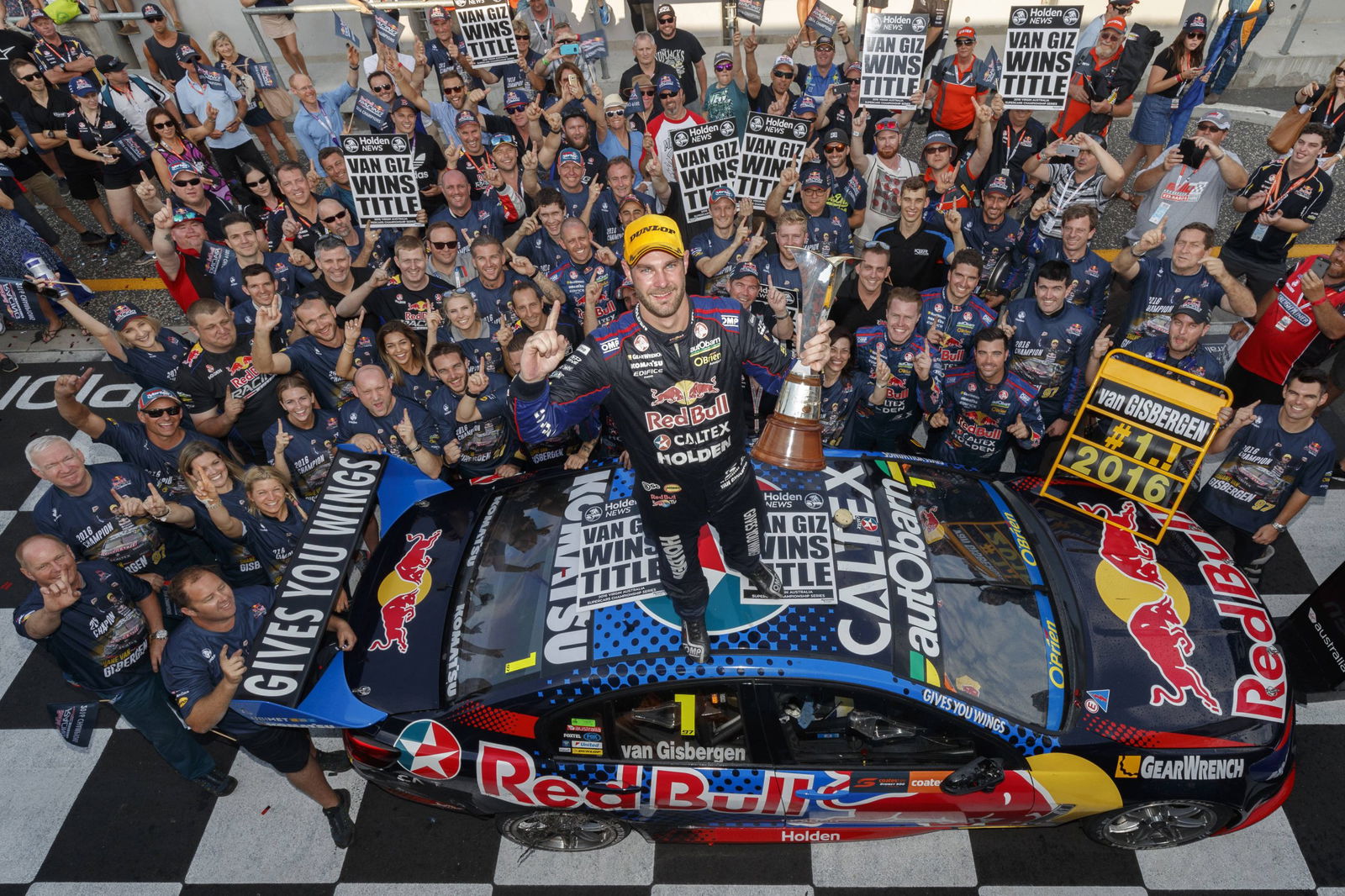 Shane van Gisbergen celebrates winning the 2016 Supercars drivers' championship.