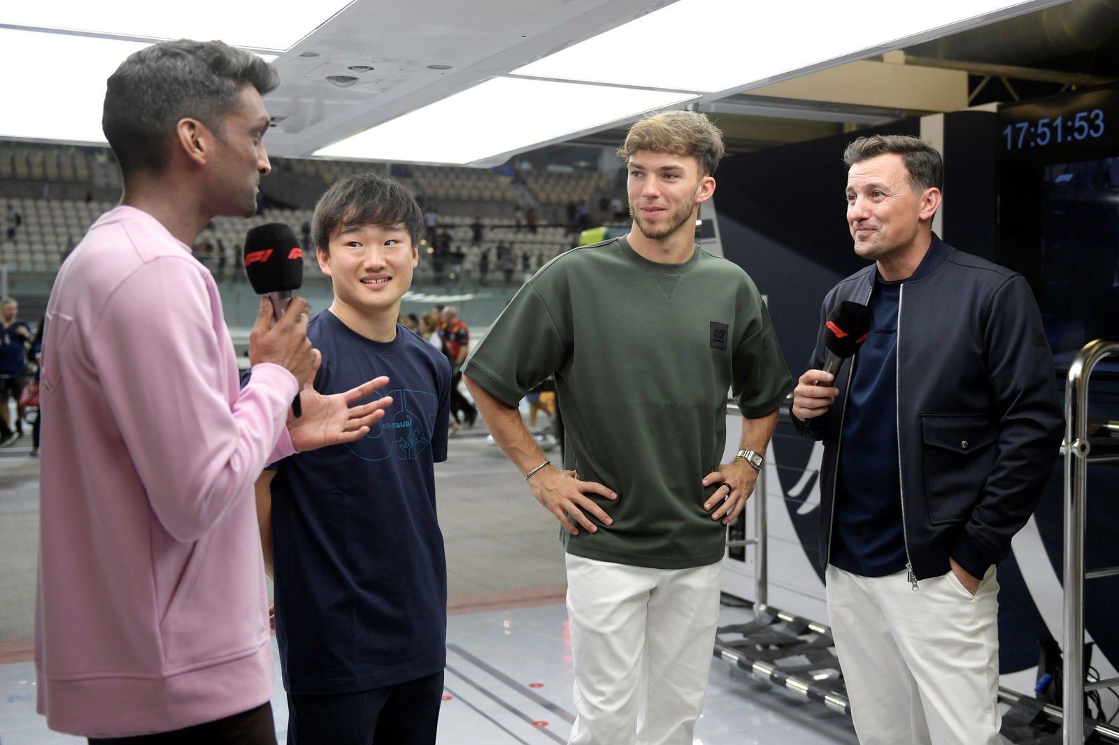 Yuki Tsunoda and Pierre Gasly talk with Lawrence Barretto (left) and Will Buxton (right) during previews ahead of the F1 Grand Prix of Abu Dhabi. Image: Rudy Carezzevoli/Getty Images