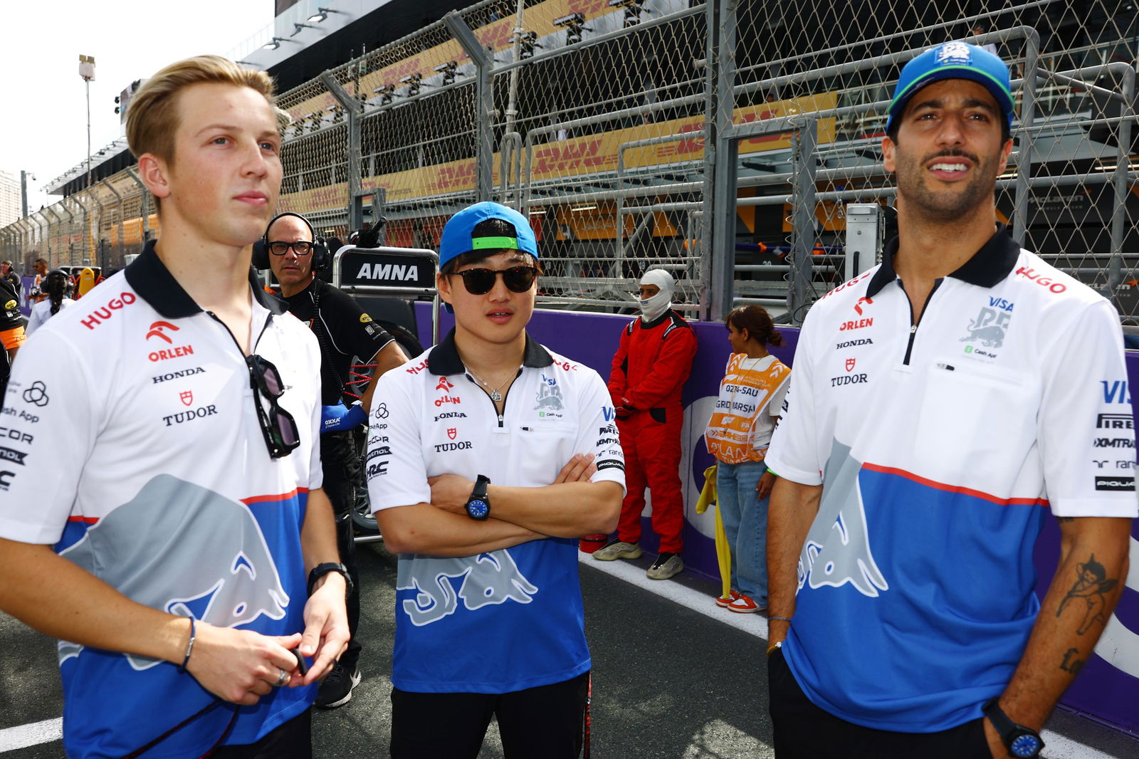 Liam Lawson (left) with Yuki Tsunoda (middle) and Daniel Ricciardo.